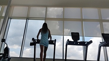 Hottie goes to the gym in a dress, gets sweaty and pees