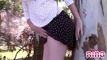 Lesbian is out in the forest getting naked and masturbating