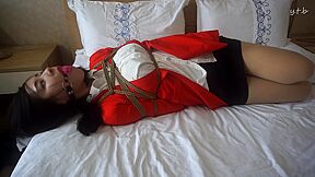 Asian In Red Suit Bound And Gagged