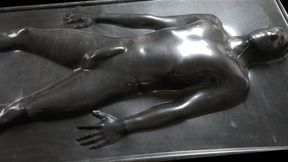 Tightly rubberized in a black latex vacbed