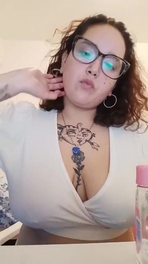 Tattooed woman in white top