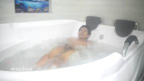 taking a bath in the tub