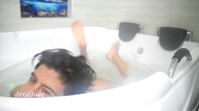 taking a bath in the tub