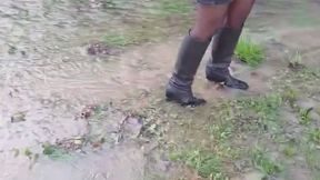 High heeled leather boots in puddles and water