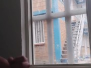 masturbating in the window facing the street