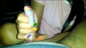 Thai teen prostitute with different nail colors gives me handjob
