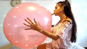 A huge pink balloon turns into shreds