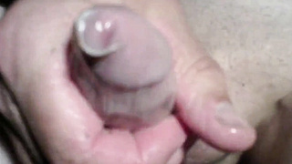 Twink's Webcam Handjob: Small Cock, Big Condom Fun