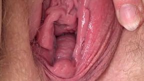 Close-ups of hairy cunt &mdash;  clitoris &mdash;  and vagina. When a mature BBW fingering to orgasm &mdash;  spreading her plump hips.
