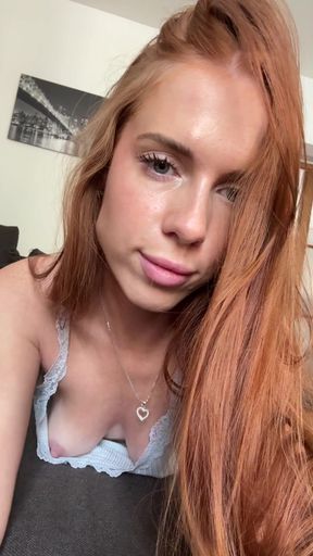 Curvy redhead reveals perky nipples in a solo nipslip reveal
