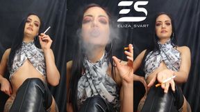 Smoking in a skull top and overknee boots