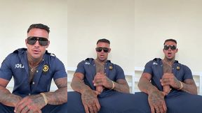 a man in police officer cosplay jerks off