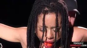 Ebony ballgagged sub anallytoyed in BDSM suspension bondage