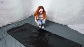 Jeans in a black vacuum bed