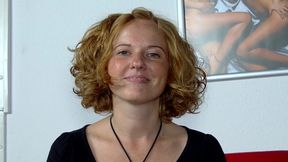 German blonde slut plays with a big dildo in solo action