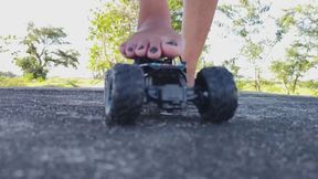 Crushing large toy car barefoot