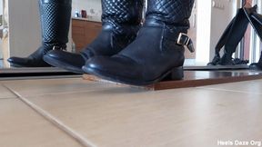 Toe Tapping in Two Pairs of Leaher Boots