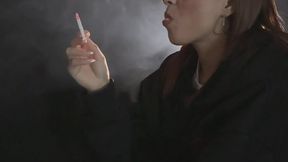 LOVE - SMOKING WITH LEGS CROSSED AND CHEWING GUM