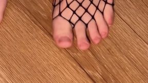 Feet in fishnets