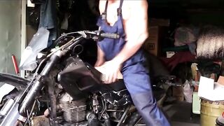 A bulky mechanic gets revved on at work and has hookup with a motorcycle whilst repairing it