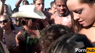 College beach party heats up with bikini teasing and passionate kissing among sun-soaked students