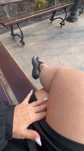 Hot stepmom shows her sexy legs on a bench in public