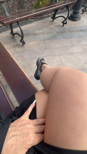 Hot stepmom shows her sexy legs on a bench in public