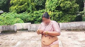 A Full-figured Woman in a White Skirt and Pink Top Strips Down and Walks Nude Outside