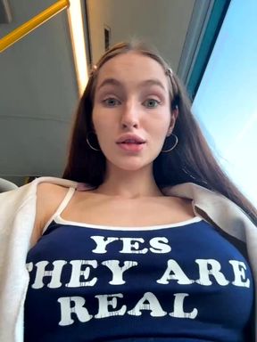 Brunette Shows Natural Assets on Train