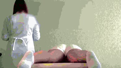 Female client undergoes intimate Brazilian waxing during a clinical roleplay session