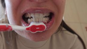 Indian stepsister brushes teeth in the bathroom and shows how to brush teeth then shows her teeth and does a big mouth fetish and tongue fetish