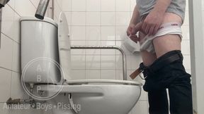 in the hospital toilets, a guy pisses into a cup for a urine sample, then gets horny, jerks-off and cums