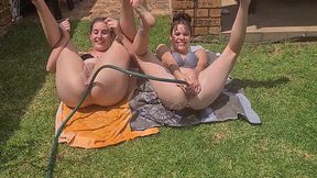 Wet and Wild Hose Play Between Two Friends