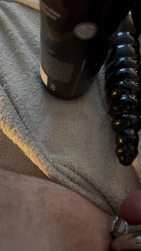 Heavy weights on my balls and a thick, huge cock in my ass.