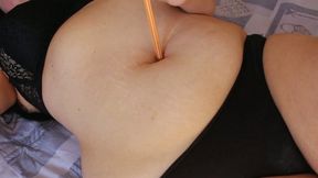 Deep navel poking with a pen