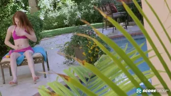 Redheaded teen Alice Green masturbates outdoors by the pool