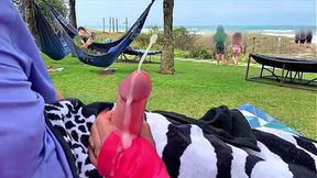 Big-titted MILF shows off her big cock-handling skills in a public beach closeup