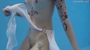Cutest tattooed teen Mimi swimming naked