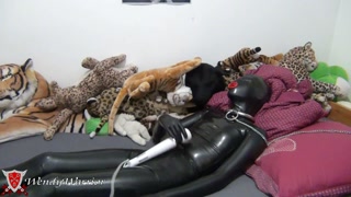 Chained and locked in Condom Catsuit