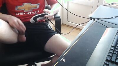 Nerdy guy plays a game and touches his cock and balls