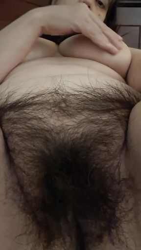 MILF admiring her fat, hairy pussy