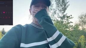 Daring girl masturbates with remote control in public nature setting