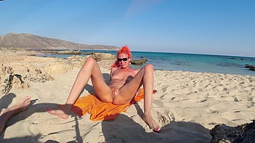 Sex with anal plug on the beach