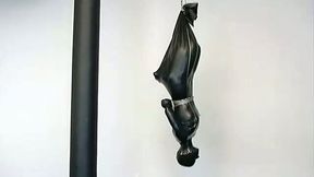 A bitch in latex overall gets suspended in BDSM scene