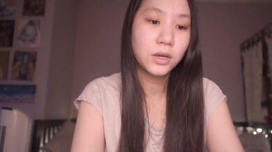 Cute T-shirted Asian ASMR girl reads pharaoh story solo at home