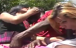 Interracial outdoor trio