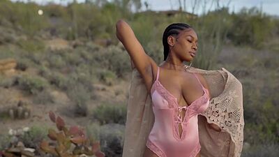 Huge boobs ebony MILF model Nyla solo striptease outdoor for Playboy