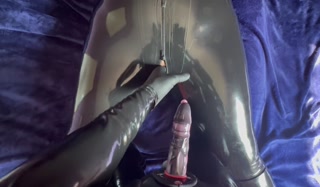Latex catsuit, strap-on penis sex.