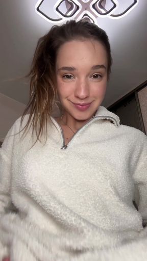 Smiling woman in white sweater
