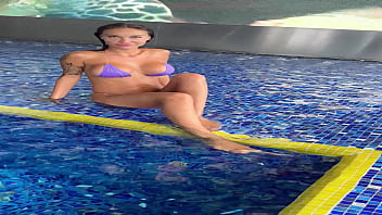 Monika Fox In Purple Bikini Swims In Pool &amp_ Poses By Window Against Background Of City (Free)